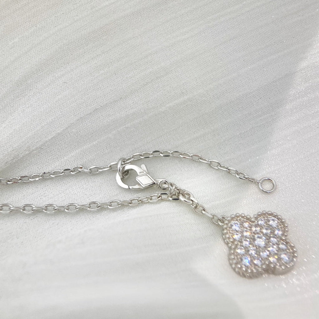 Lumi® Kleeblatt-Halskette mit 5 Motiven aus Silber und Diamanten