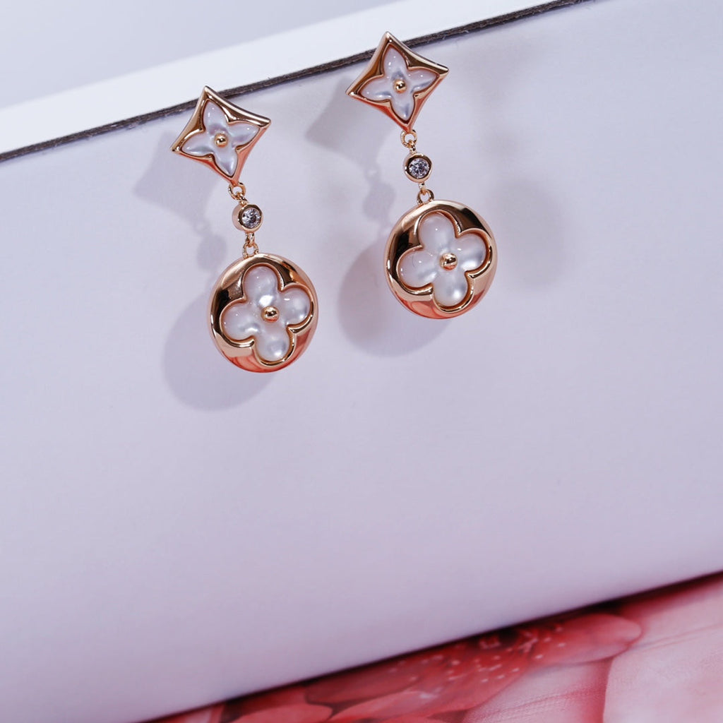 Lumi® Stern- und Sonnenohrringe in roségoldener Perlmuttform