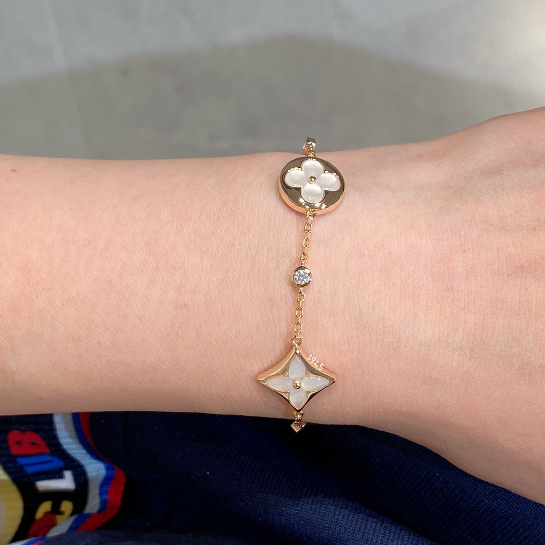 ¡®Lumi¡¯STAR AND SUN 4 MOTIF WHITE MOP PINK GOLD BRACELET