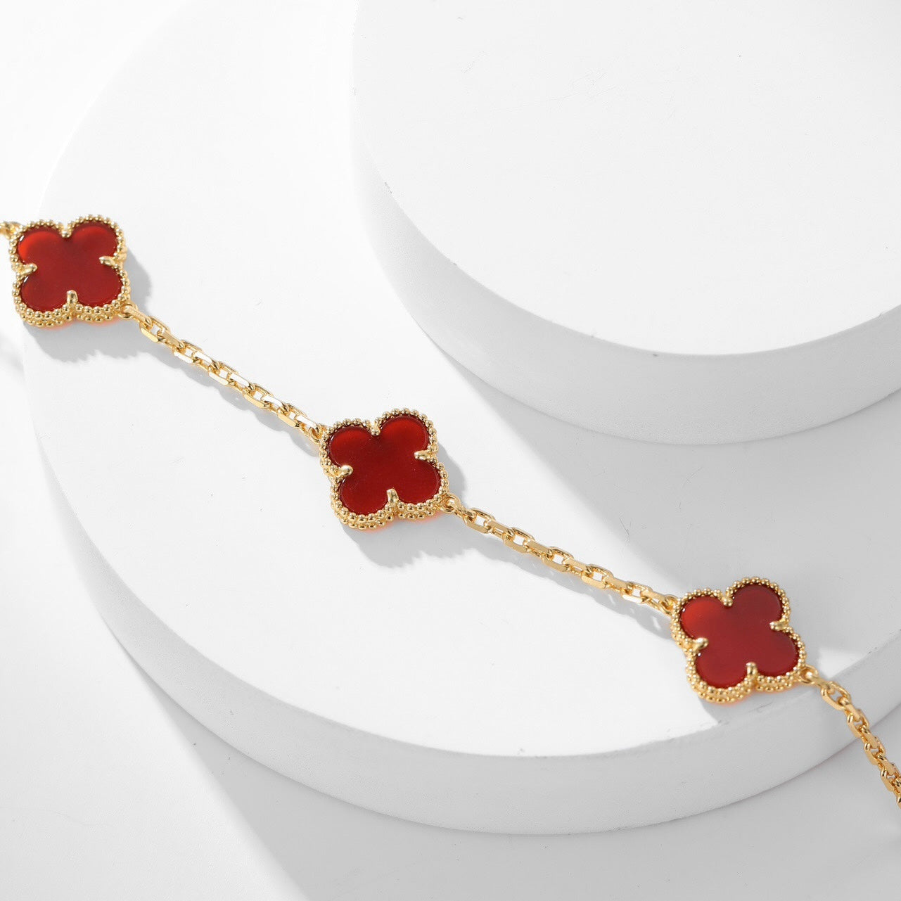 Lumi® Kleeblatt-Halskette mit 10 Motiven aus Karneol