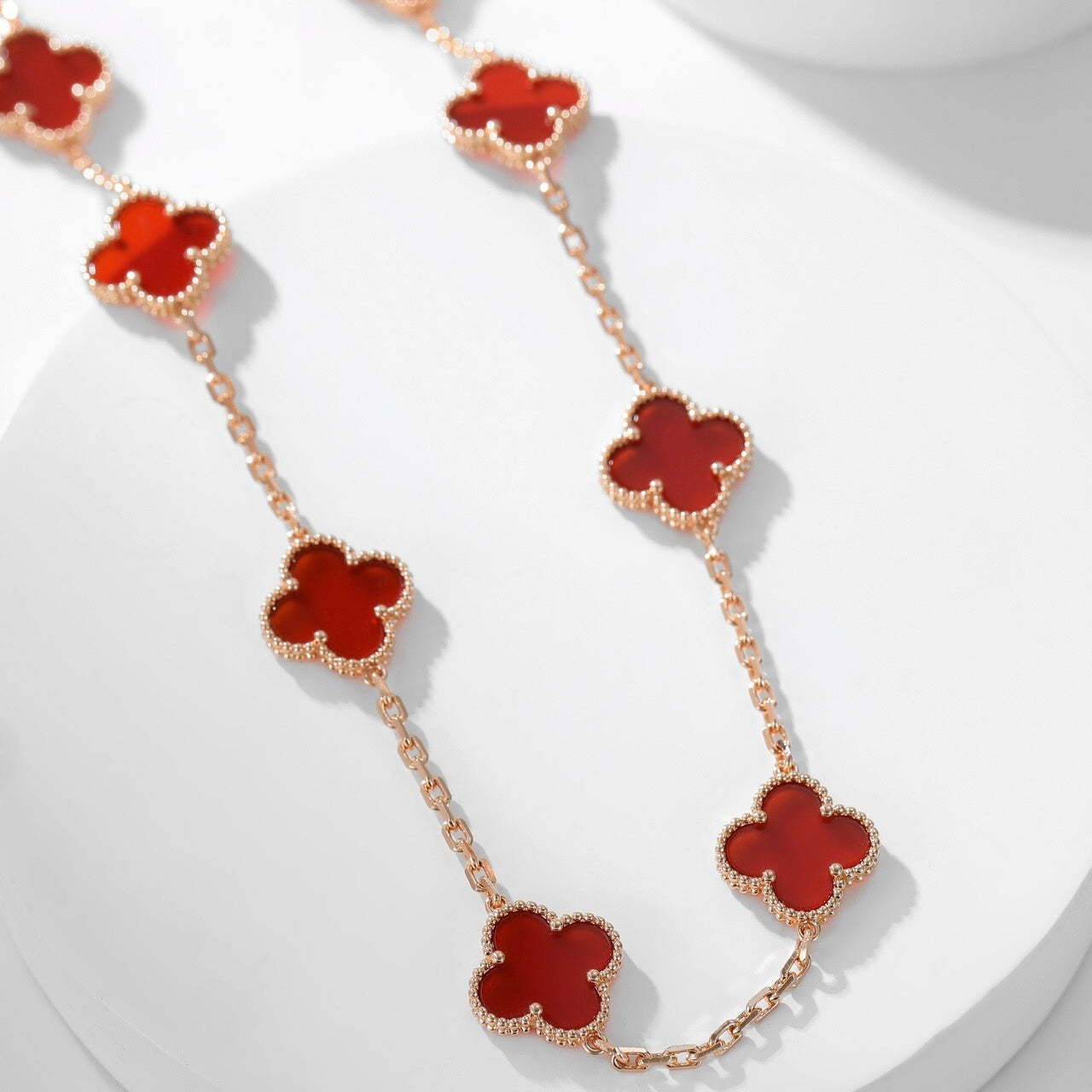 Lumi® Kleeblatt-Halskette mit 10 Motiven aus Karneol