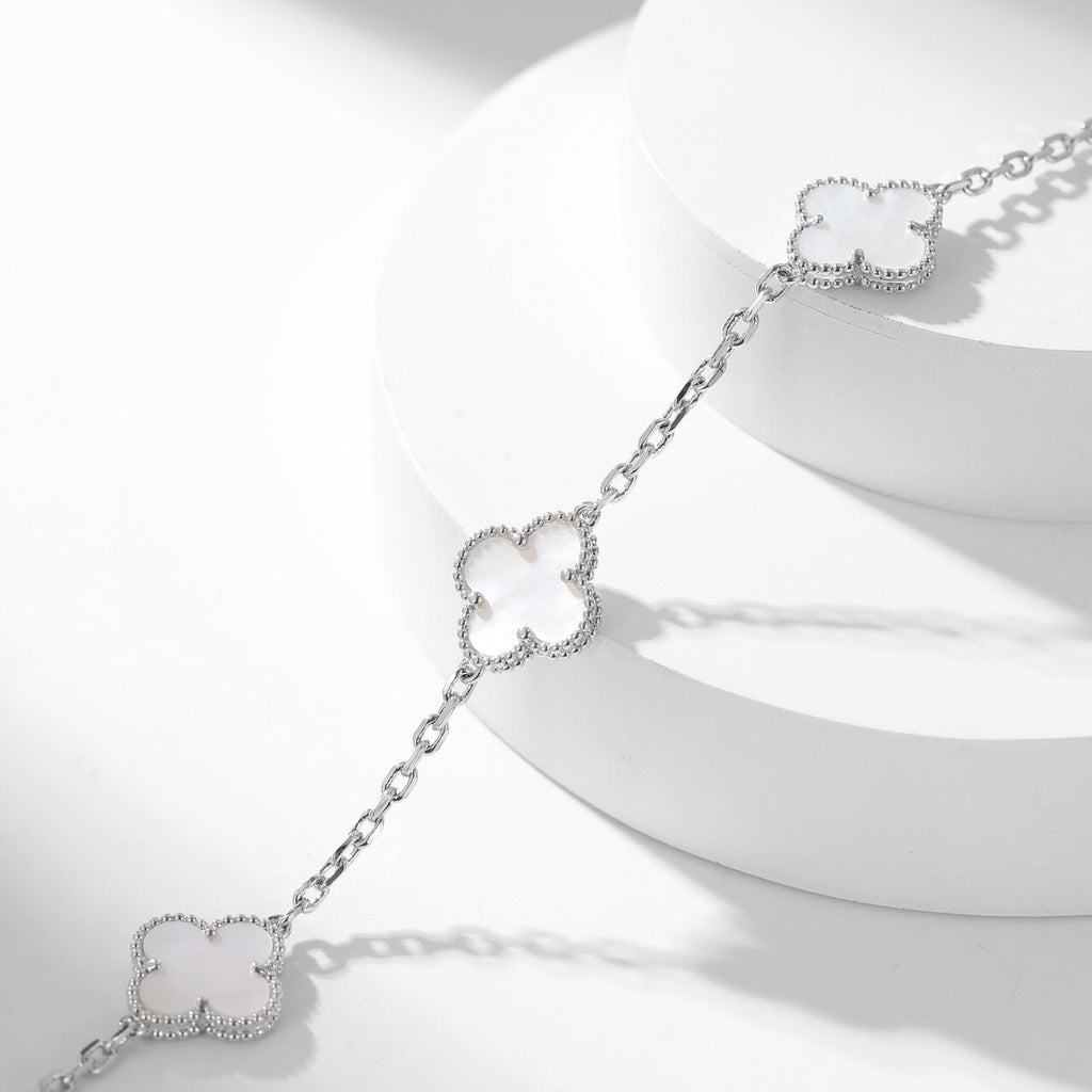 Lumi® Kleeblatt-Halskette mit 10 Motiven aus weißem Perlmutt